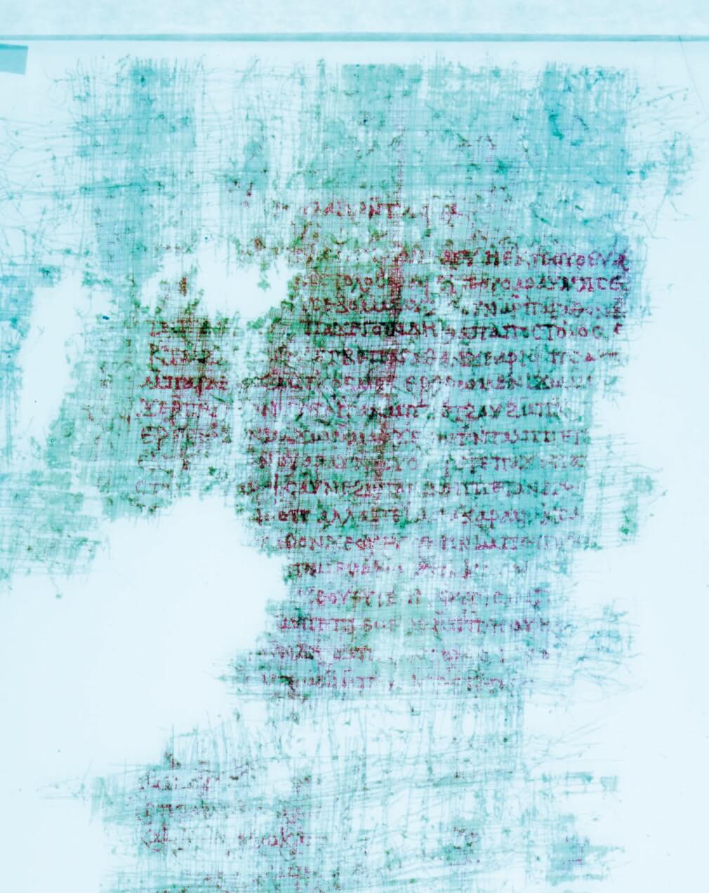 Image enhanced photograph of Kephalaia Codex plate 240, which glows in luminous light blue.