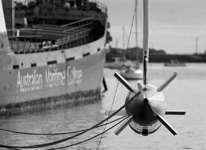 Black and white photograph of the nupiri muka being deployed into the water. Nupiri muka is the name of the University of Tasmania’s new autonomous underwater vehicle. Nupiri muka means 'Eye of the Sea' in palawa kani, the language of Tasmanian Aborigines.