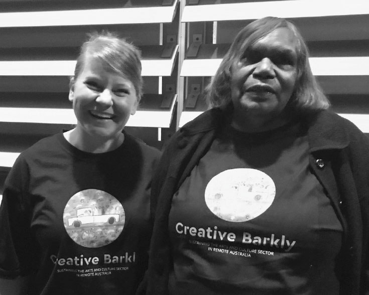 Black and white photograph of Associate Professor Brydie-Leigh Bartleet, the Creative Barkly Team Leader, with Warumungu Elder, Traditional Owner and Advisor to the project, Rosemary Plummer.