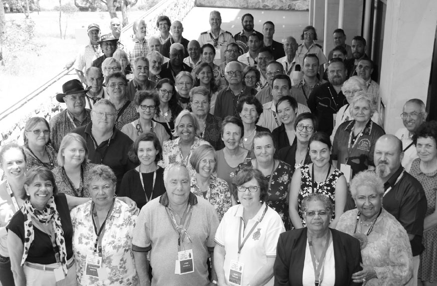 Black and white photograph of attendees at the conference.