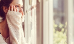 Girl looking through the window