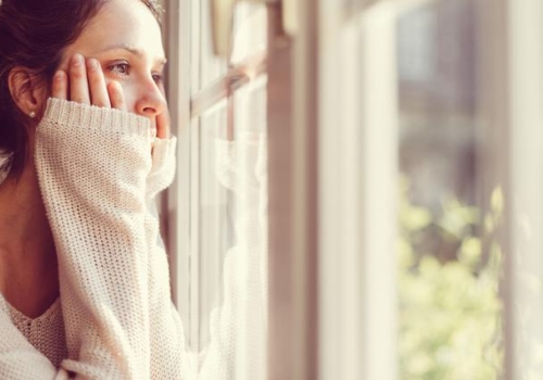 Girl looking through the window