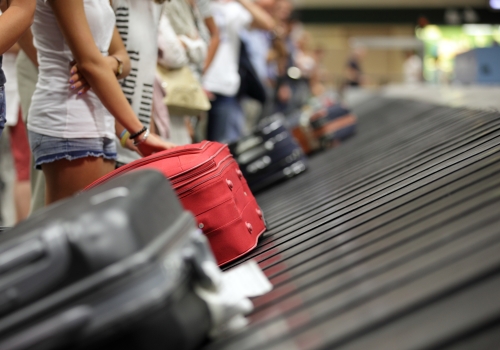 visitors waiting for luggage at Changi Airport